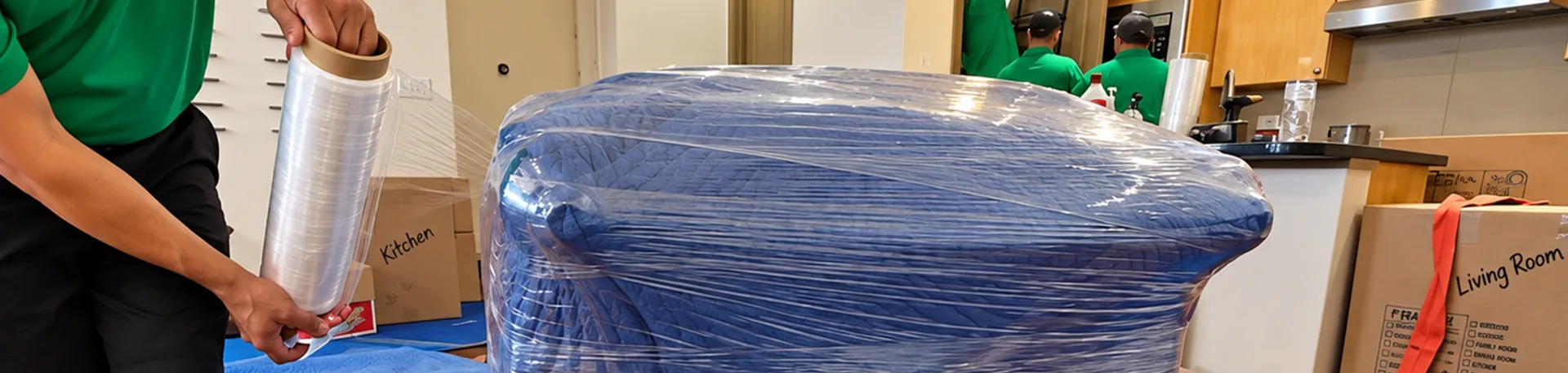 Careful Furniture Wrapping | Oler Relo Moving In-State Moves Oler Relo Moving crew wrapping furniture in protective plastic during an in-state move