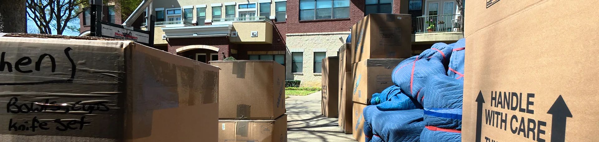 Packed and Ready | Oler Relo Moving In-State Moves Packed and labeled moving boxes staged outside a home, ready for an Oler Relo Moving in-state move